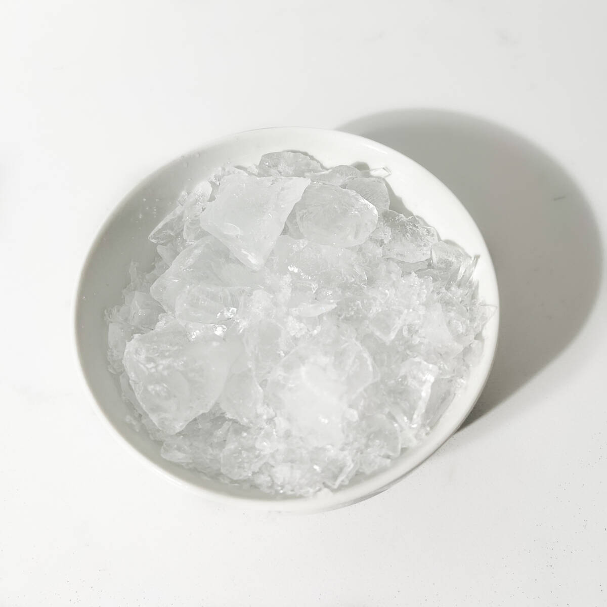 Bashed ice in a small bowl.
