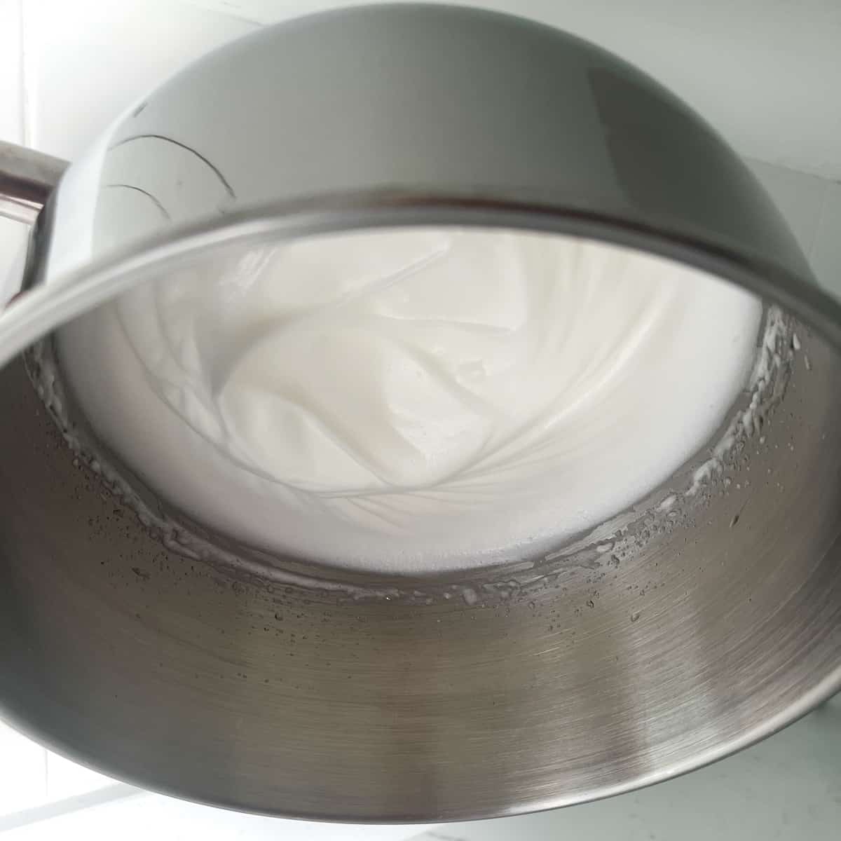 Egg whites for the mini meringues in an upside down bowl to demonstrate the stiffness.