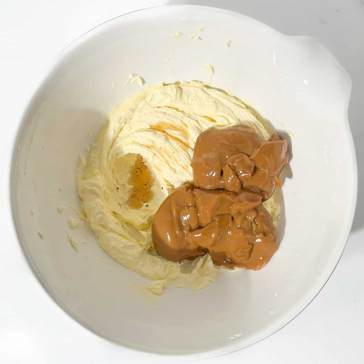 Caramelised condensed milk and vanilla added to the beaten butter and sugar mixture.