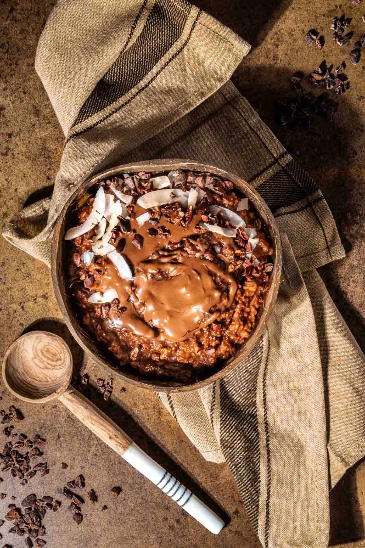 Chocolate porridge in a bowl, topped with Nutella.