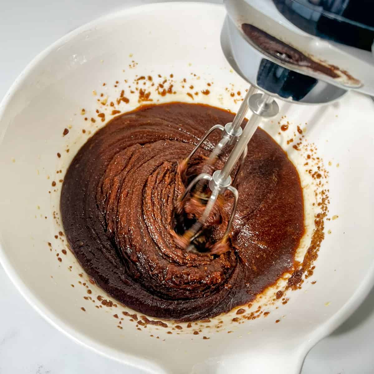 Beating dark brown sugar and butter.