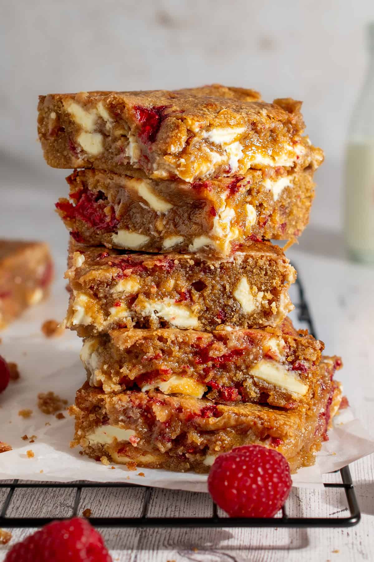 A stack of raspberry and white chocolate blondies.