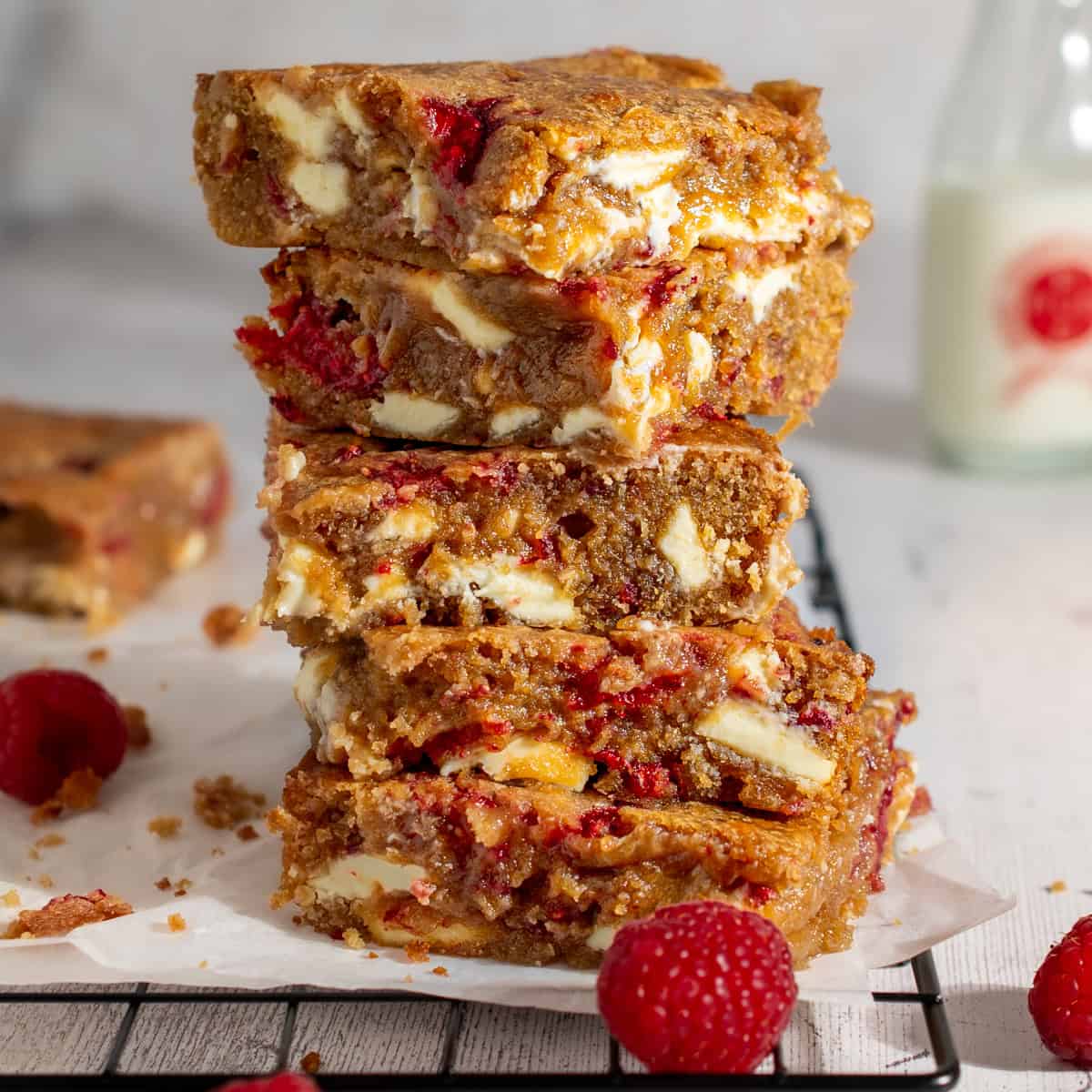 A stack of raspberry and white chocolate blondies.