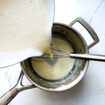 Adding the creme pattisiere mixture back into a saucepan.