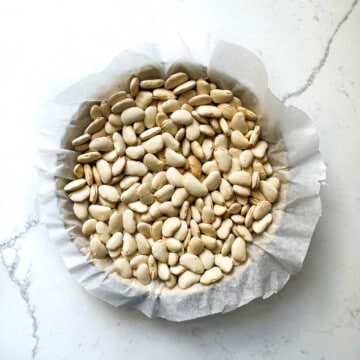 Baking beans in a tart tin.