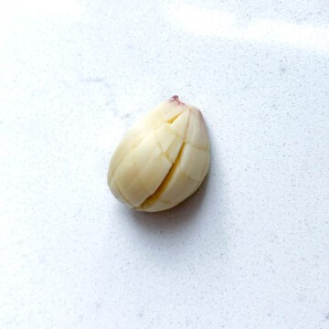 A scored garlic clove.
