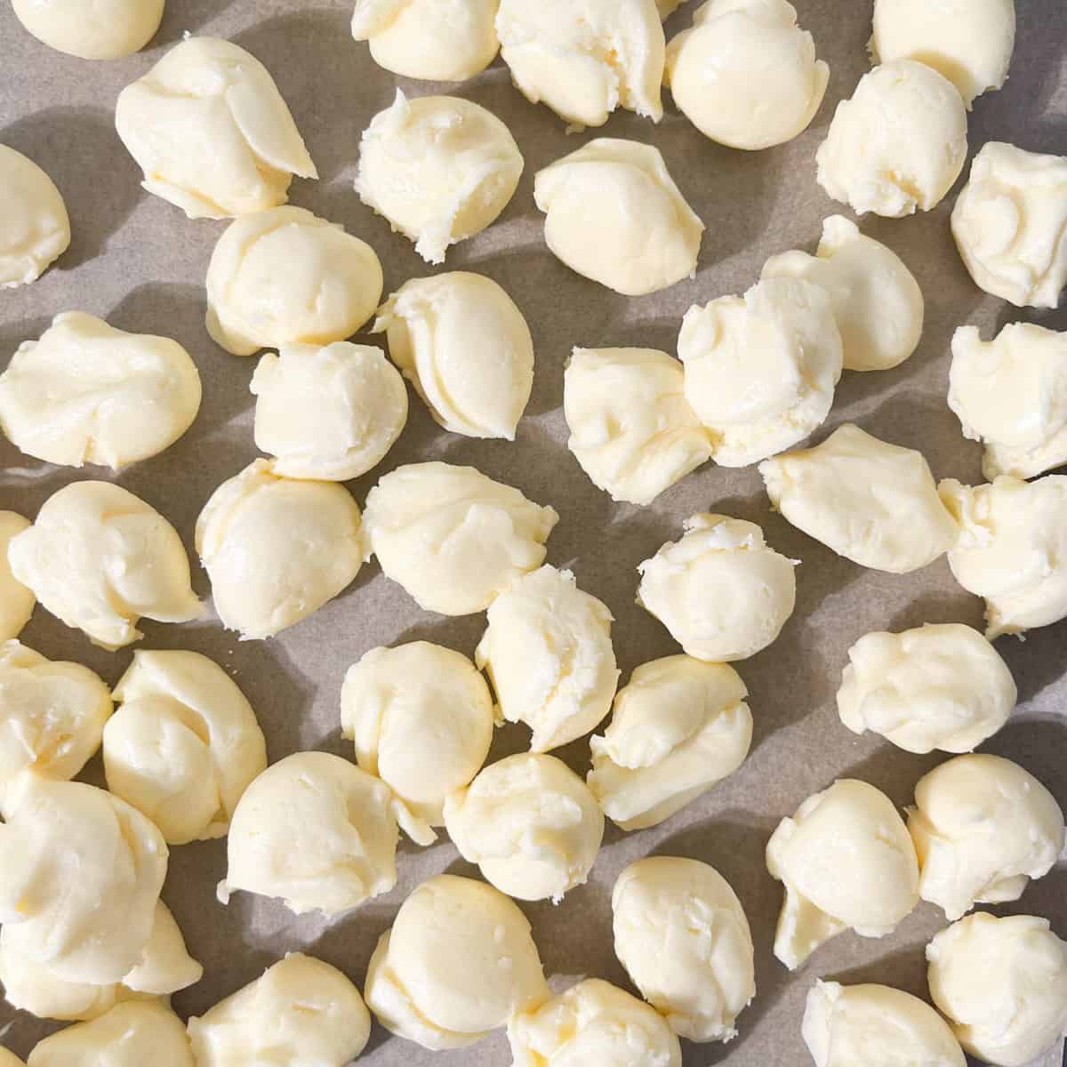 Pieces of measured out sequilho dough, ready to be rolled into balls.