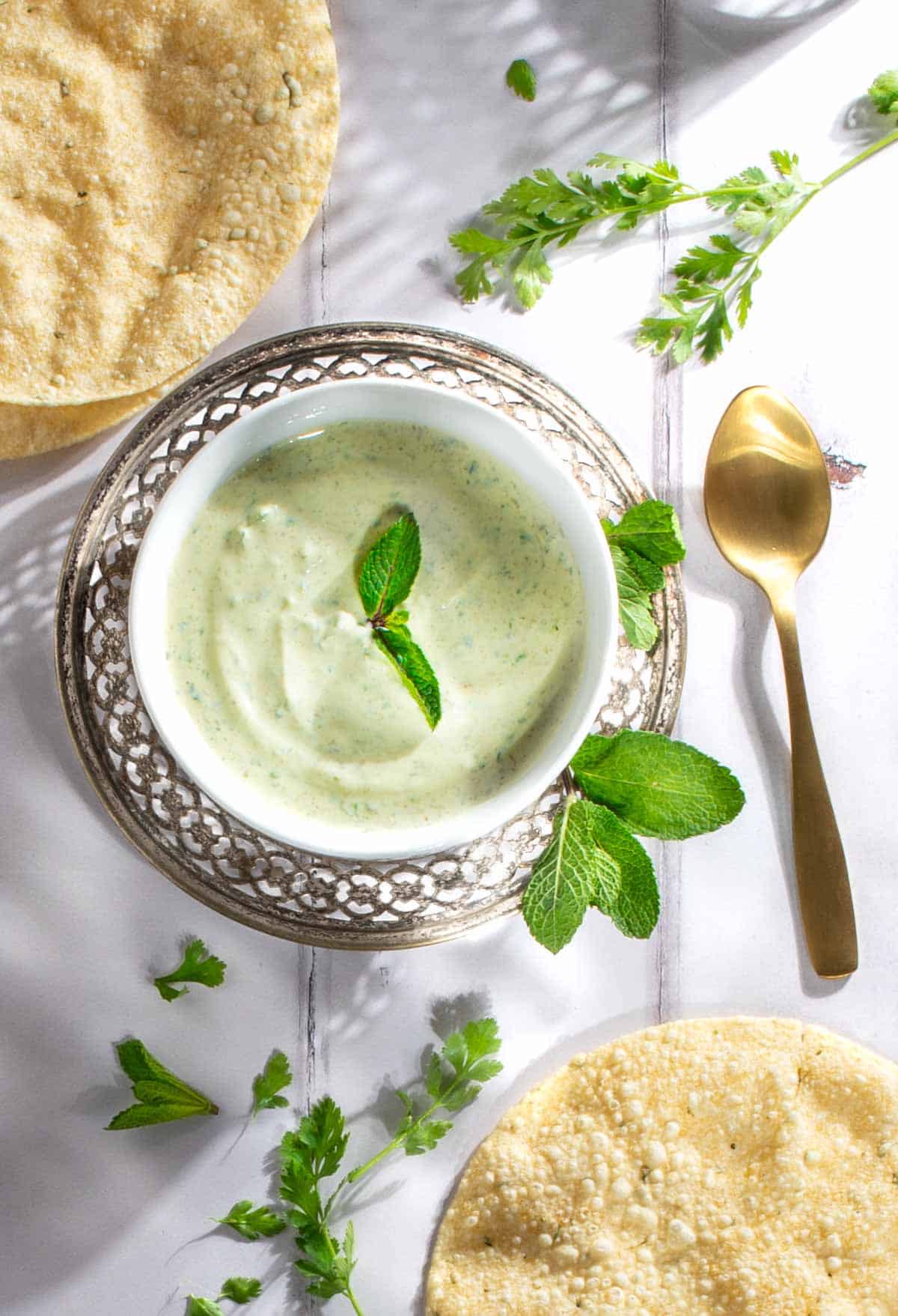 Indian mint sauce in a white bowl.