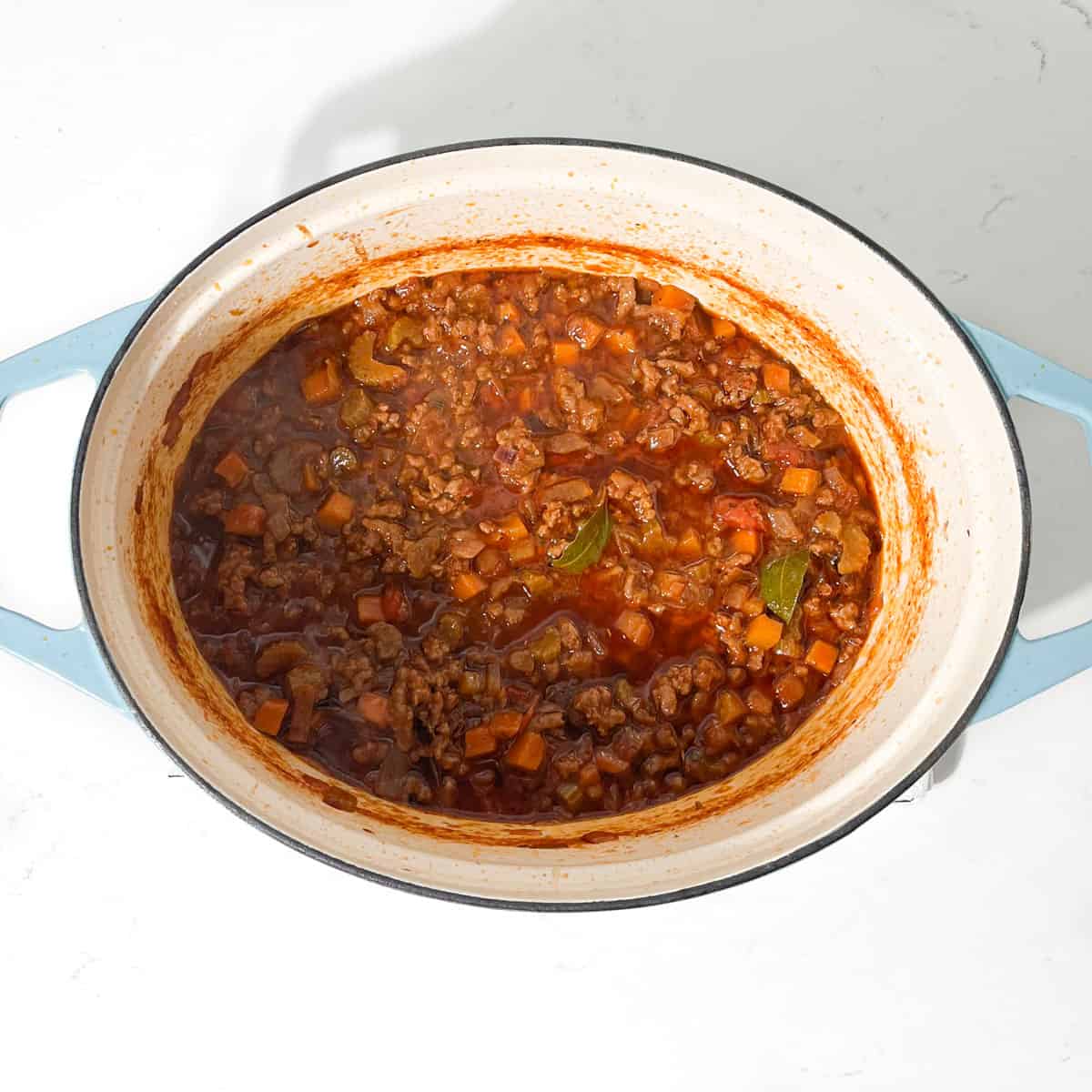 Mince for the mince and dumpling recipe cooked in a large pot.