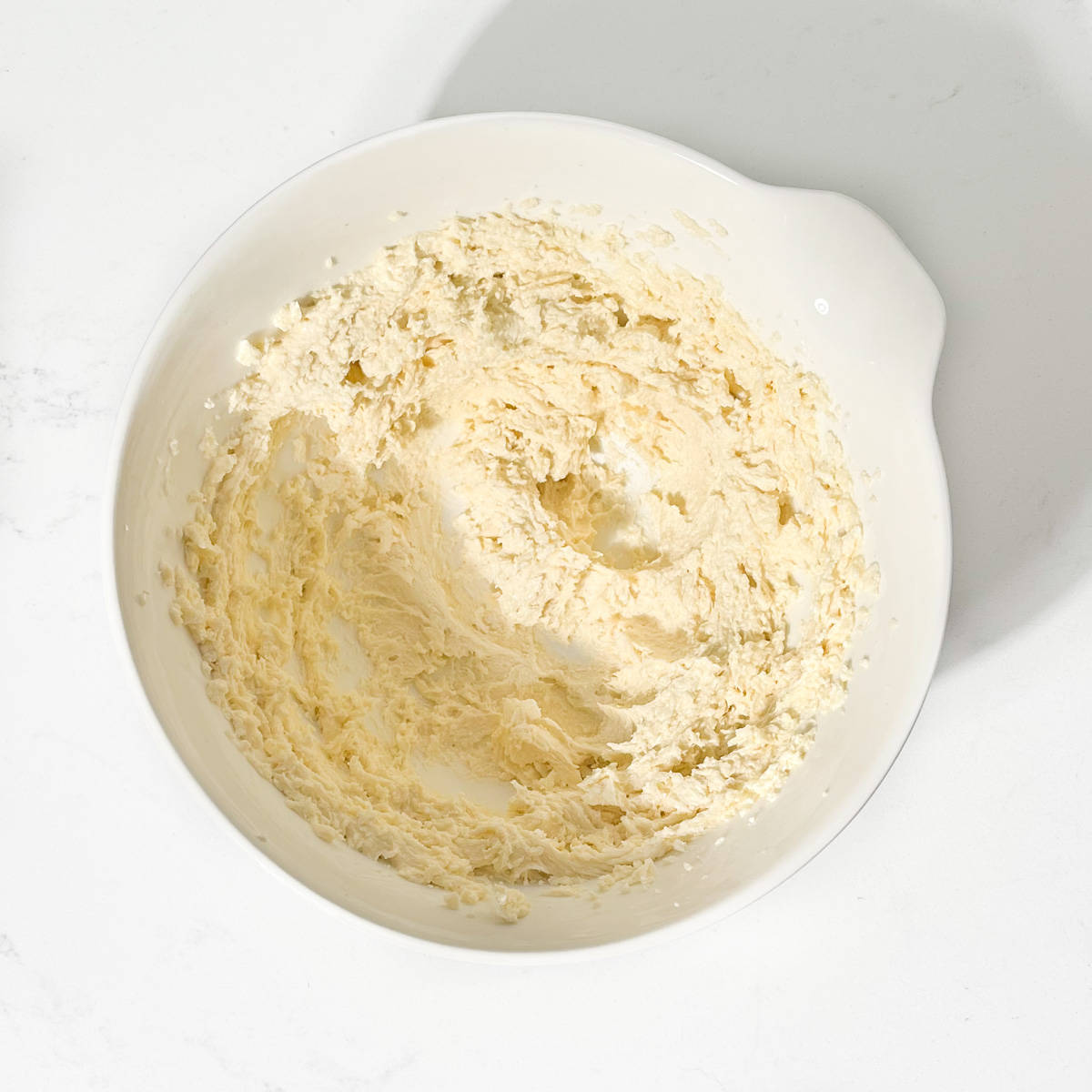 Frangipane batter in a white bowl.