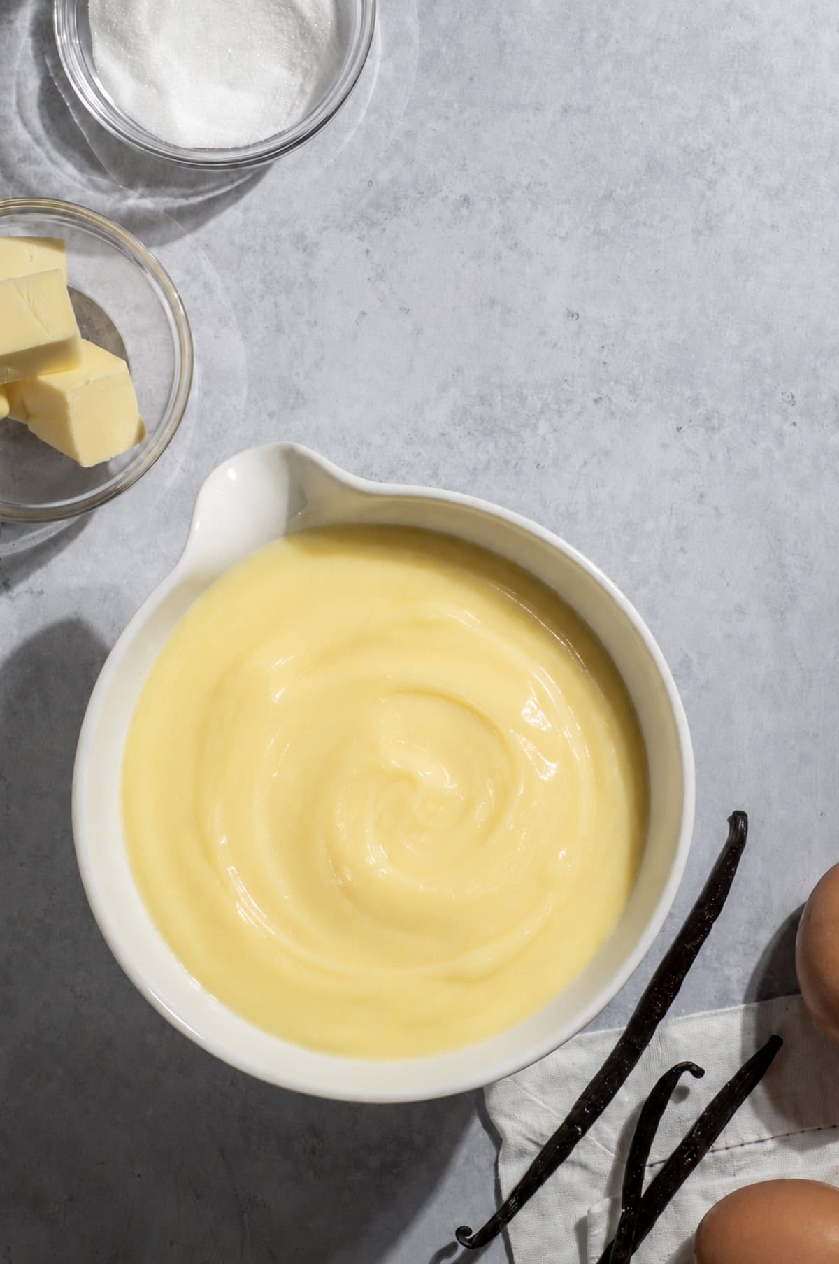Crème Pâtissière in a large white bowl.