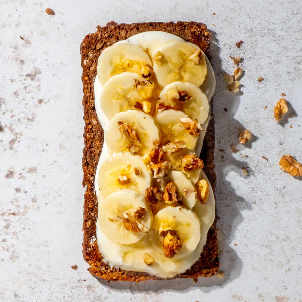 Cottage cheese toast with banana and honey topping.