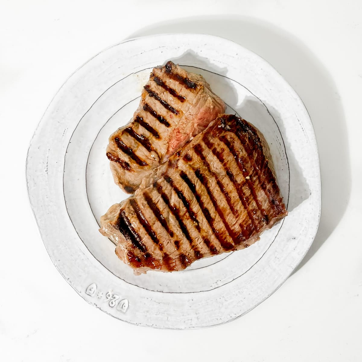 Cooked steak on a plate.