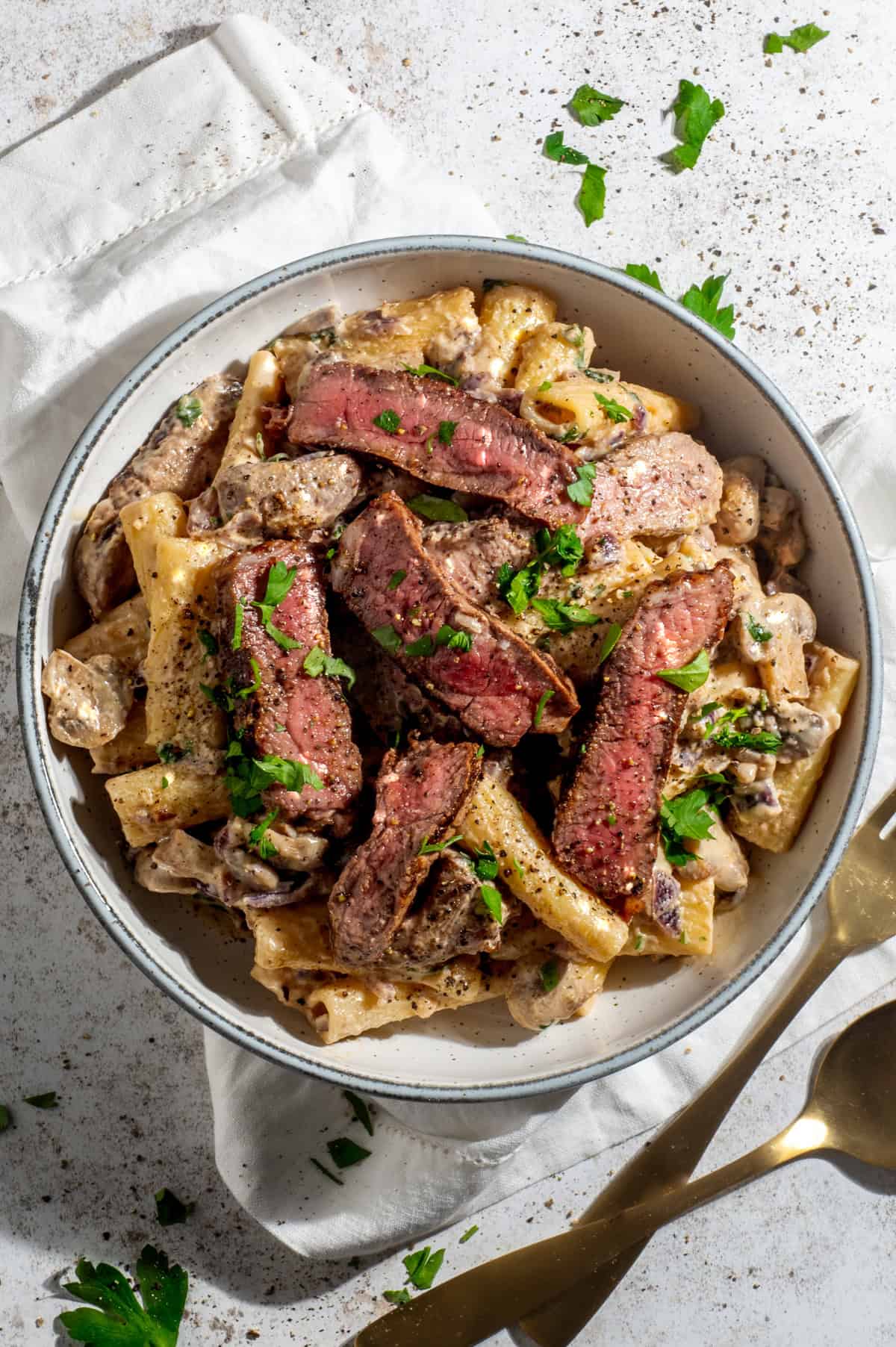 Creamy steak pasta with mushroom whisky sauce in a bowl