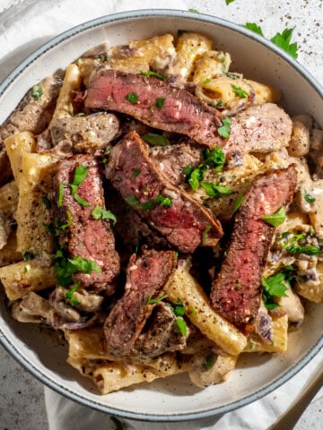 Creamy steak pasta with mushroom whisky sauce in a bowl