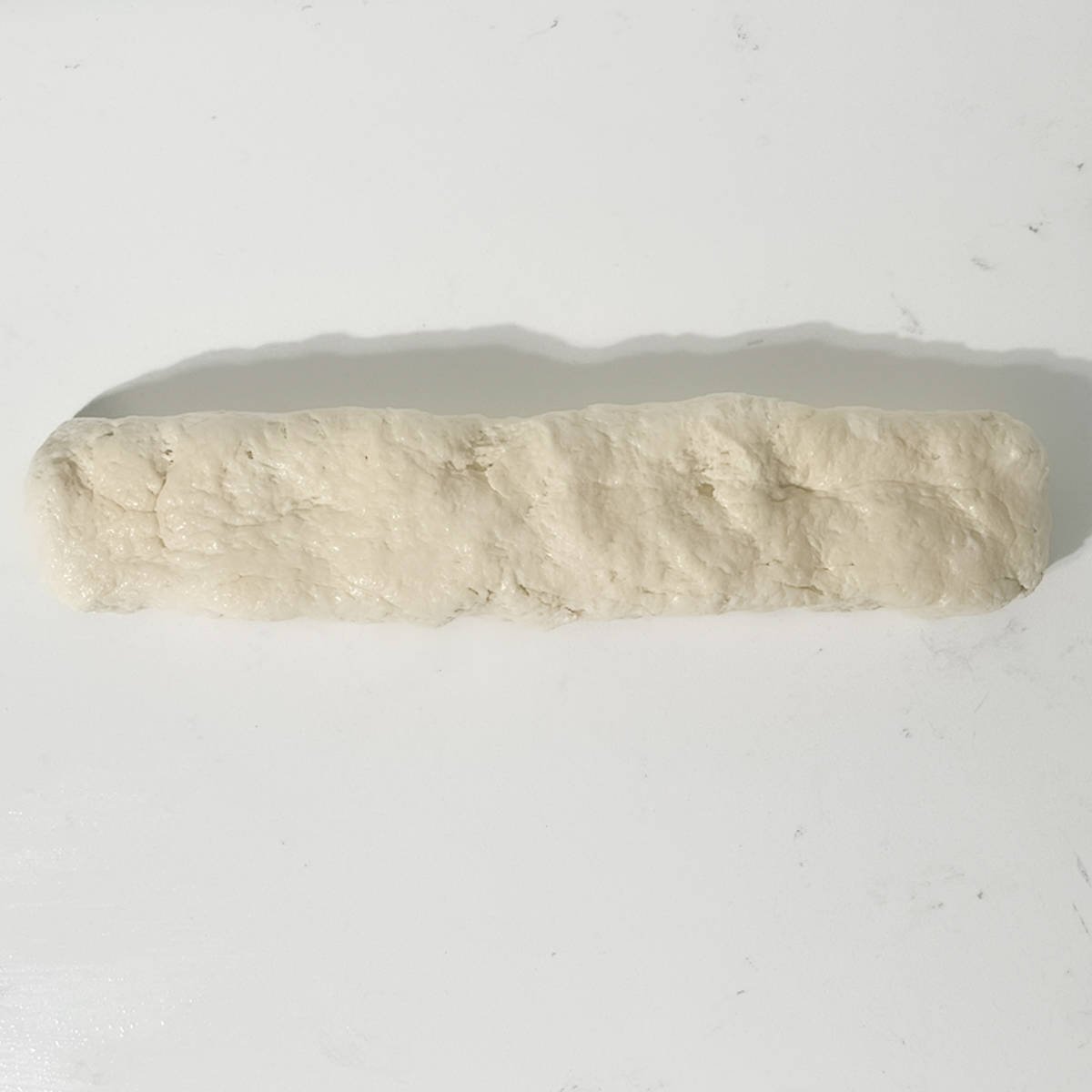 The dough rolled into a sausage.