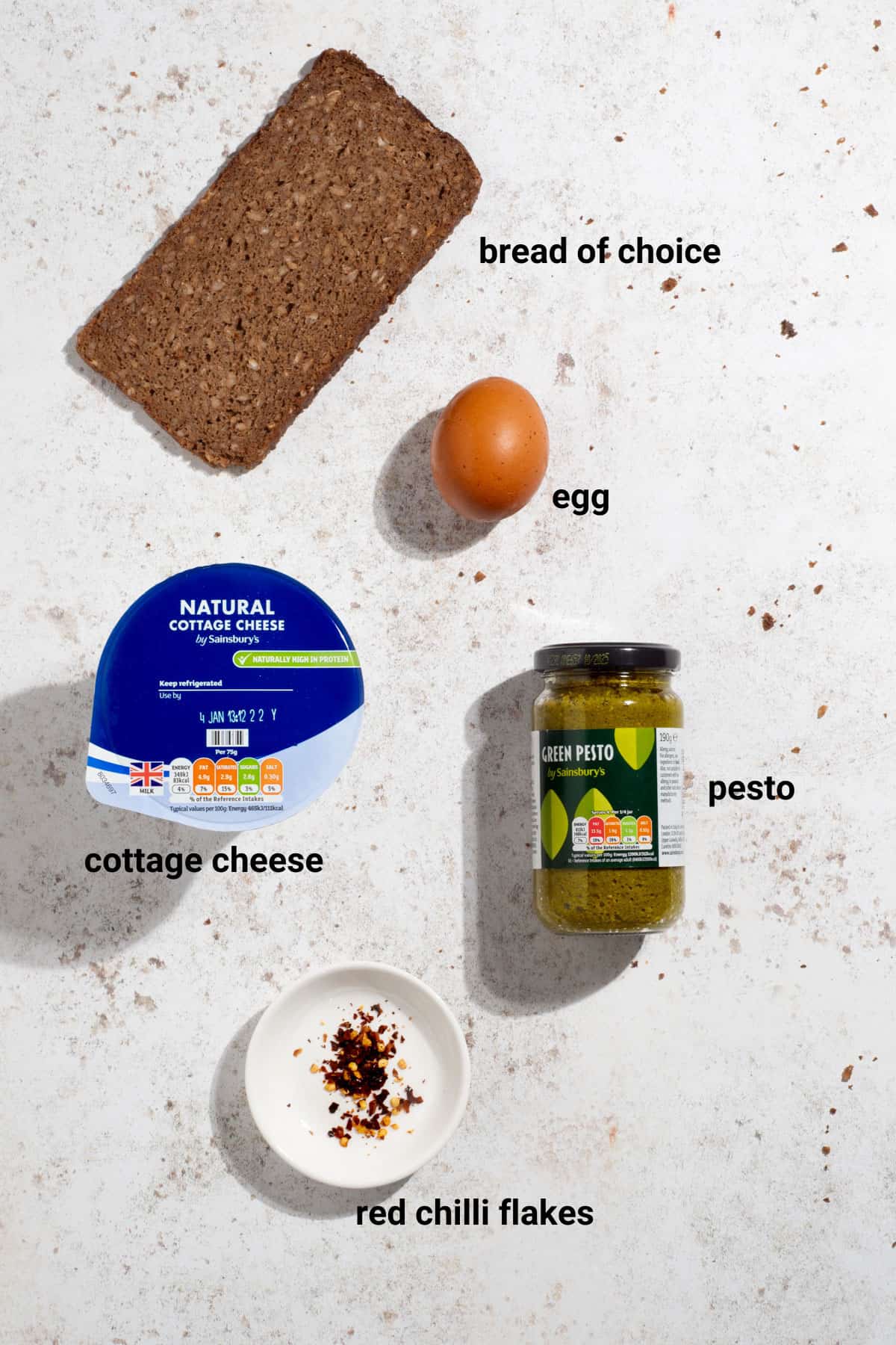 Fried egg and pesto toast ingredients.