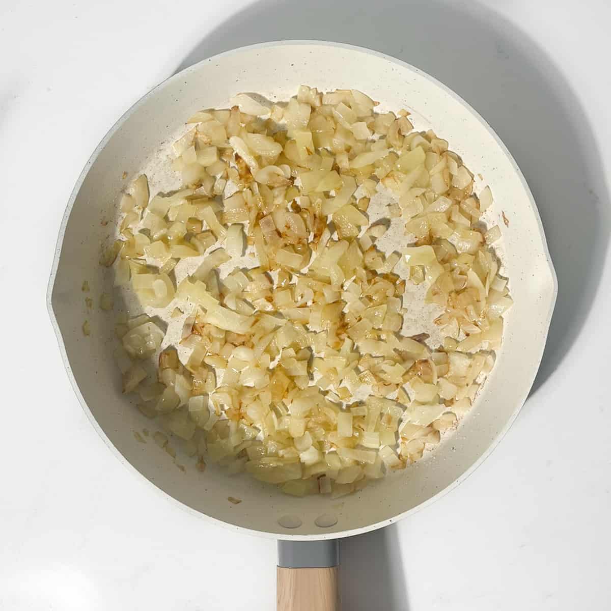 Frying onions in a small pan for the meatzza.