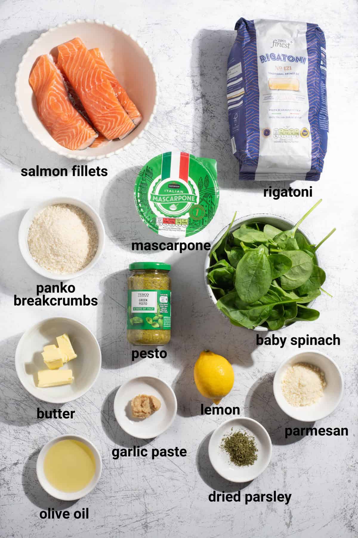 Pasta with salmon and pesto ingredients.