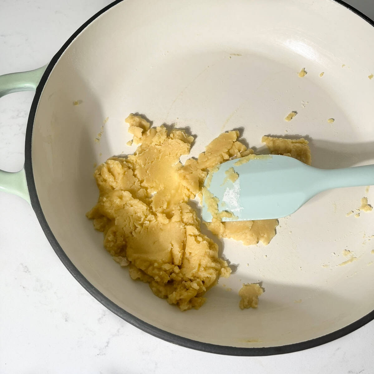 Making the roux with butter and flour in a large saucepan.